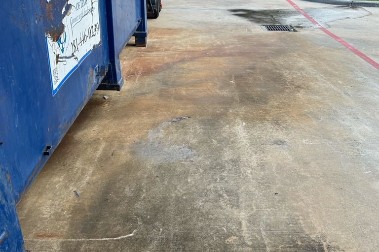 Dumpster Stains in Parking Lot