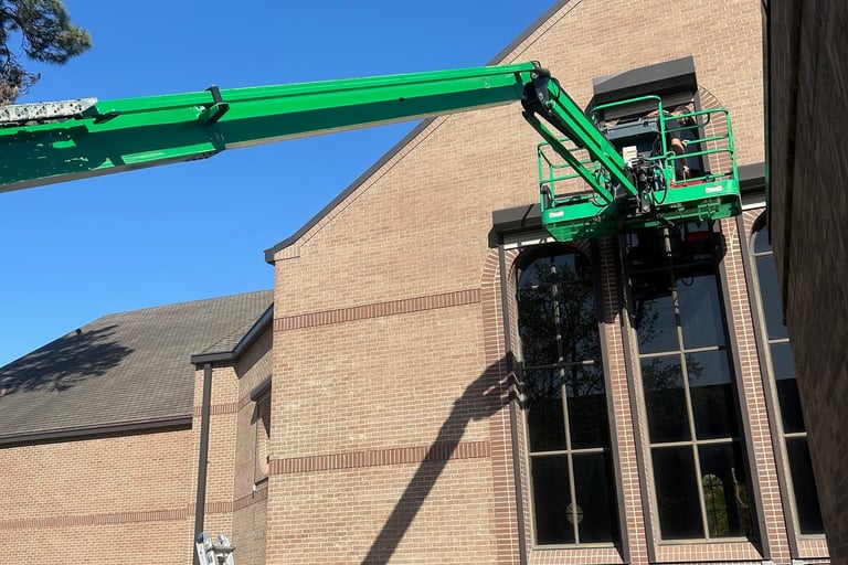 Using lift to clean high windows a ladder will not reach