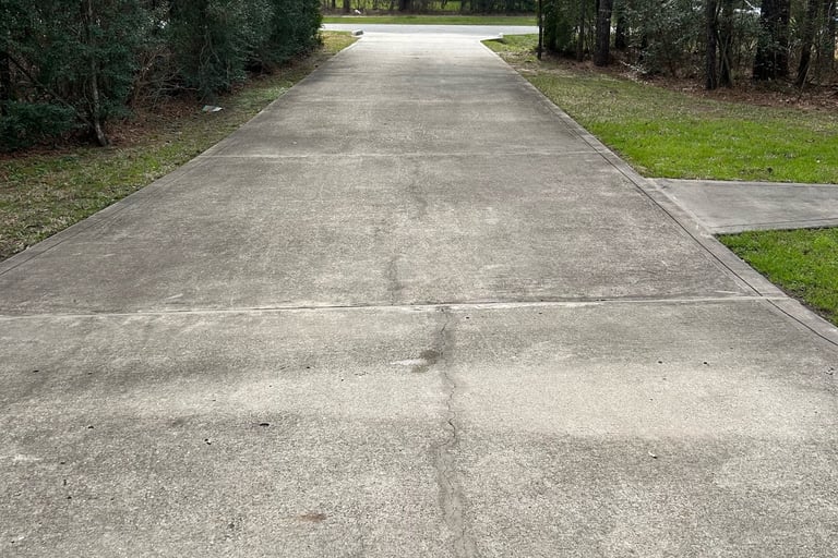 Driveway before pressure washing