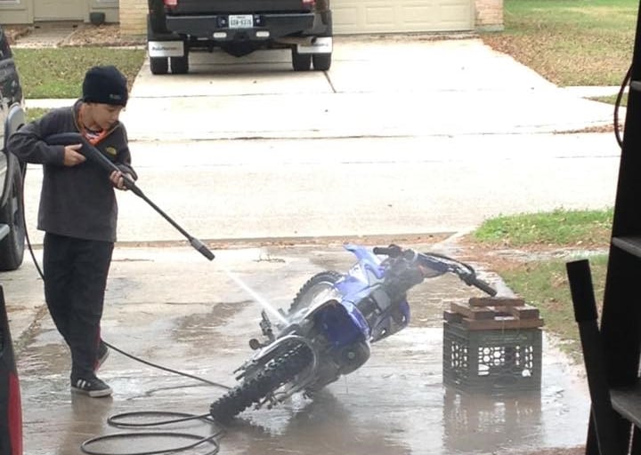 Santiago, Pressure Washing his dirt bike at a young age