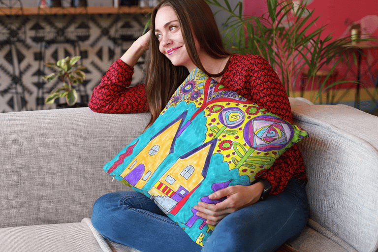Woman sitting holding a Throw Pillow