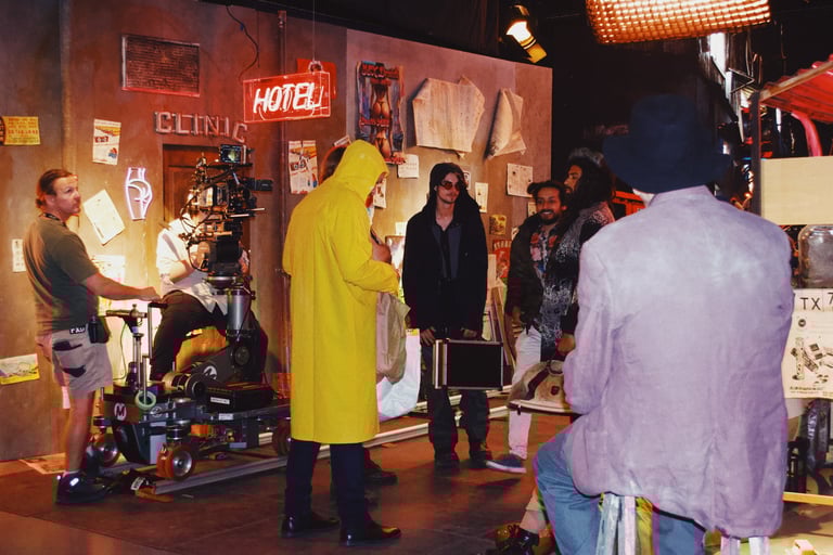 a man in a yellow raincoat is standing in a room