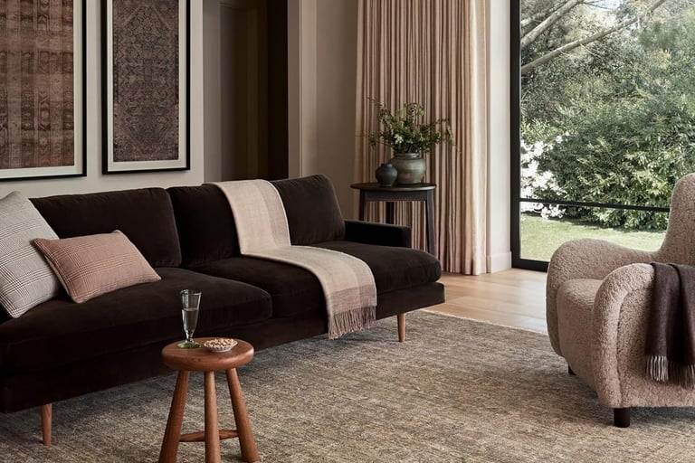 a living room with a couch and a chair