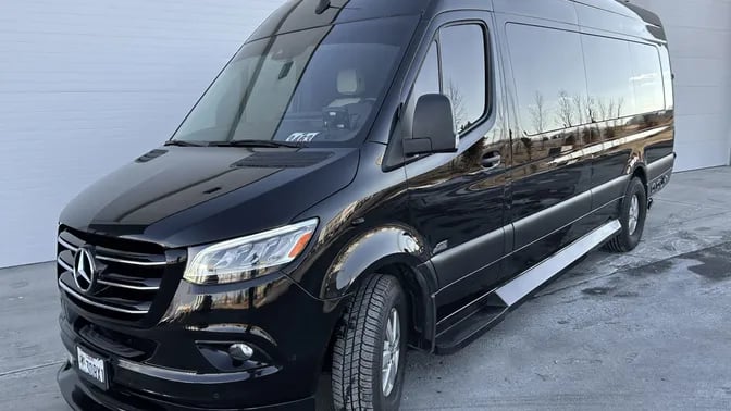 a van parked in front of a garage