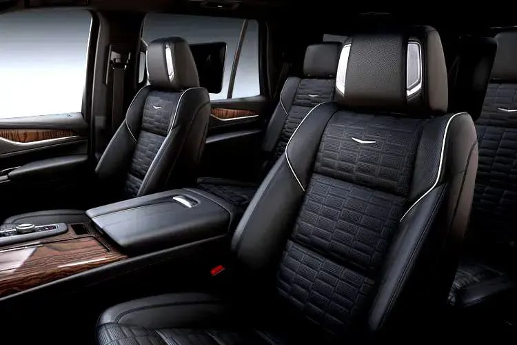 a car with black leather seats and a wooden table