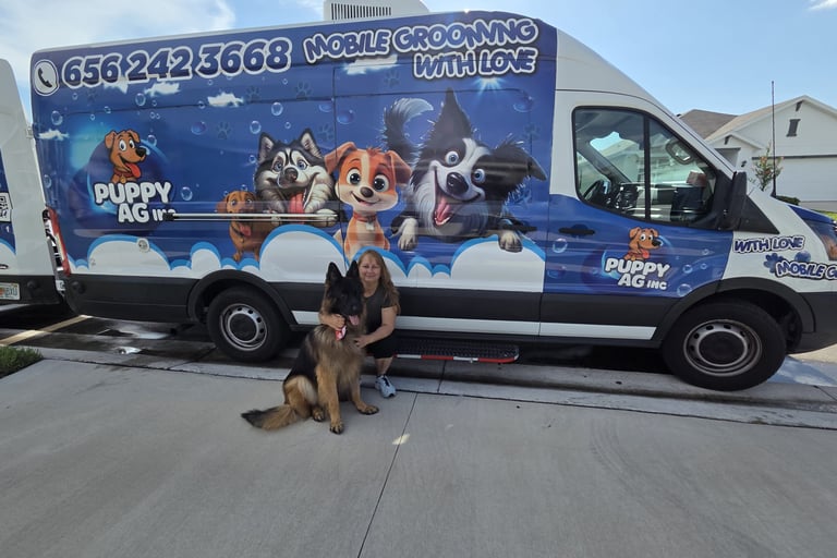 Professional mobile dog grooming van with cartoon dog graphics and a German Shepherd posing outside.