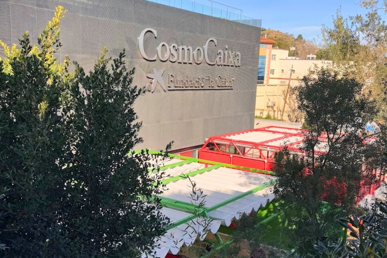 cosmocaixa museum buildin with text "cosmocaixa fundacio la caixa"