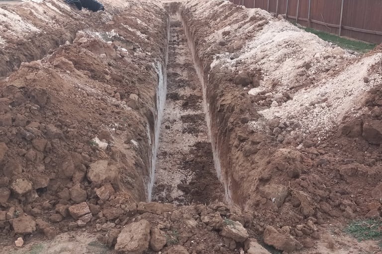 Trench excavation perfectly level by Red Dirt Ditching and Septic LLC Wolfforth, Texas. 806-782-5800
