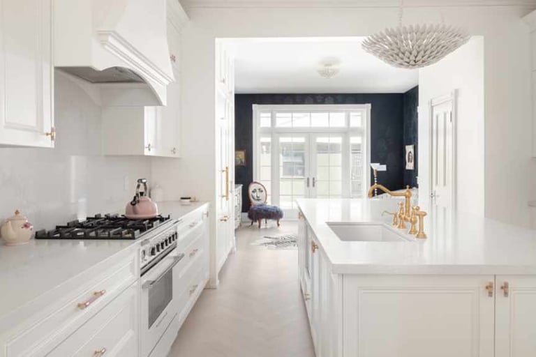 a kitchen with a white counter top and a white counter top