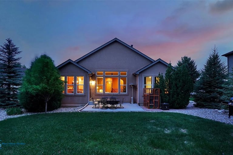 a house and backyard at twilight