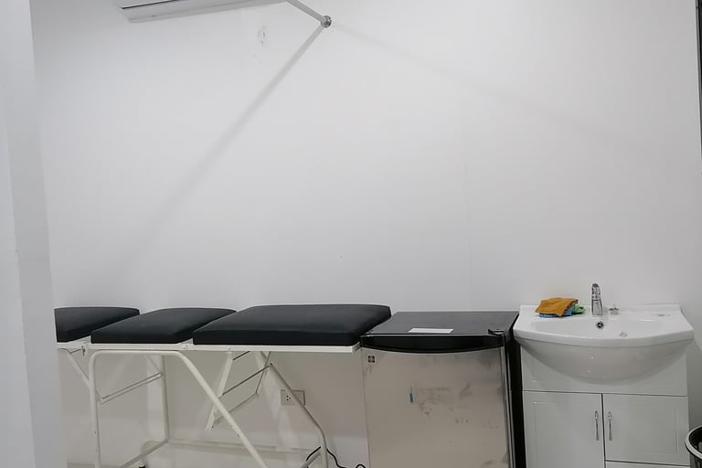 a room with a table and a sink