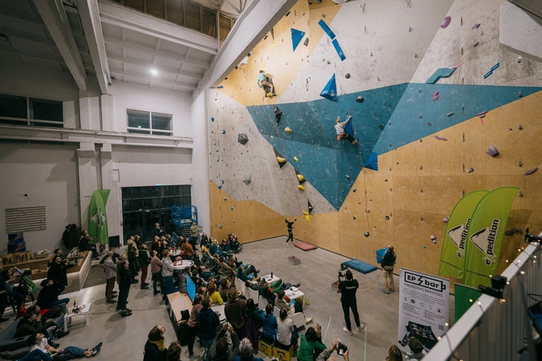 a group of people lead climbing in front of a crowd