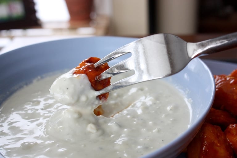 buffalo chicken bite dipped in blue cheese dressing