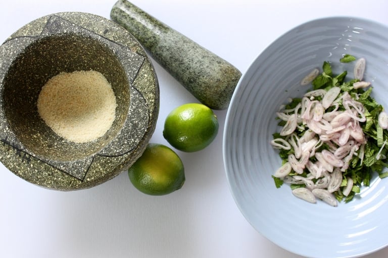 mortar and pestle with uncooked rice