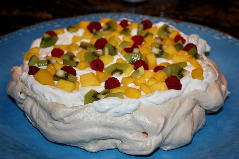 pavlova with raspberries, kiwi, and mango