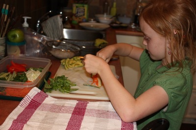 child making fresh spring rolls
