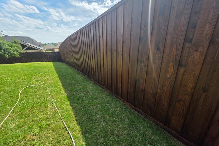 after image of power washing a fence