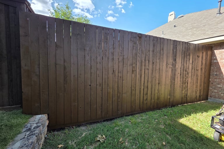 after picture of a fence cleaning