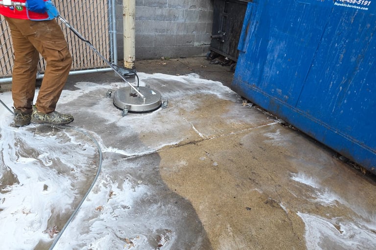 dumpster enclosure in the process of getting cleaned