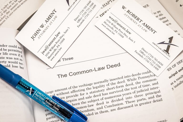 a pen and papers on a table
