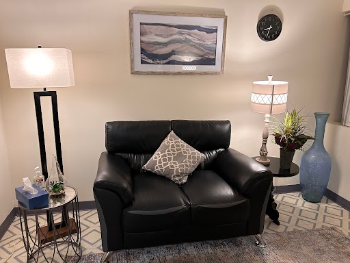 Sunrise Counseling Center Babylon Office room with a black couch