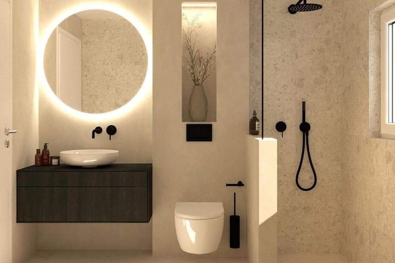 Modern beige bathroom featuring a backlit circular mirror, floating vanity, and walk-in shower with black fixtures.