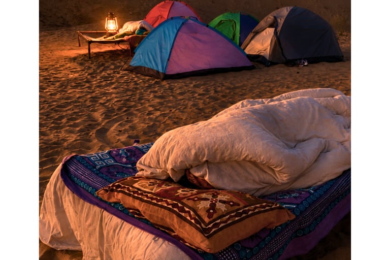 Comfortable bedding for sleeping under the stars in the Thar Desert.