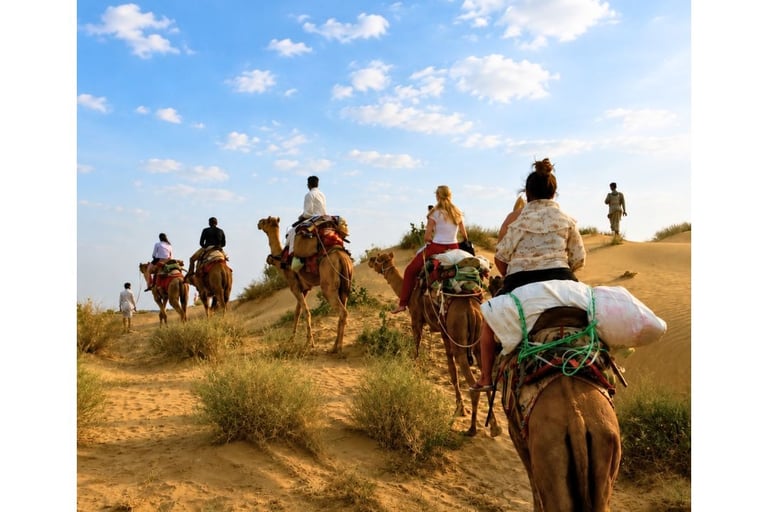 Camel safari through private sand dunes near Jaisalmer.