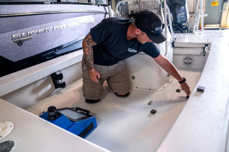 Vital Marine technician performing 3D digital scan of boat deck for custom SeaDek design in Ontario