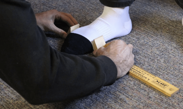 Professional cycling shoe fitting assessing foot shape and width