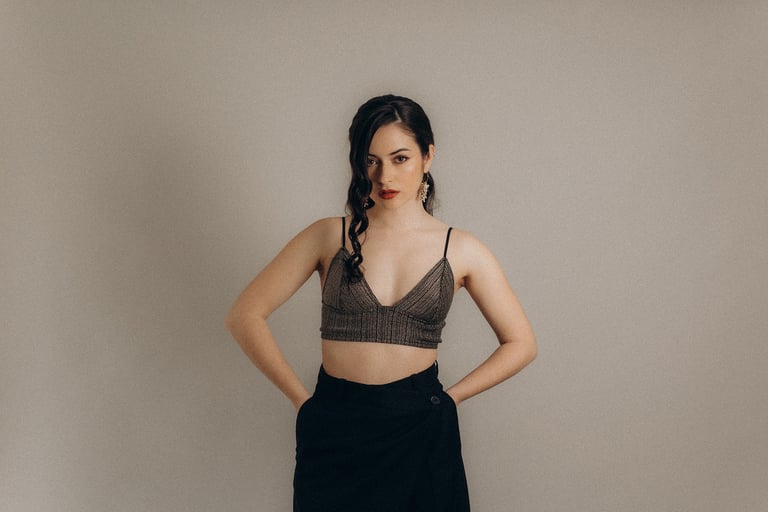 a woman in a bra top and skirt