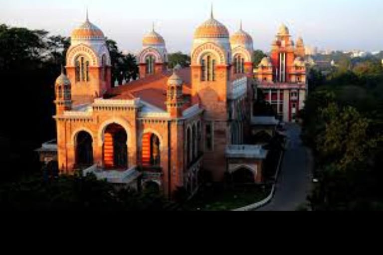 a large building with a clock tower in the middle of it