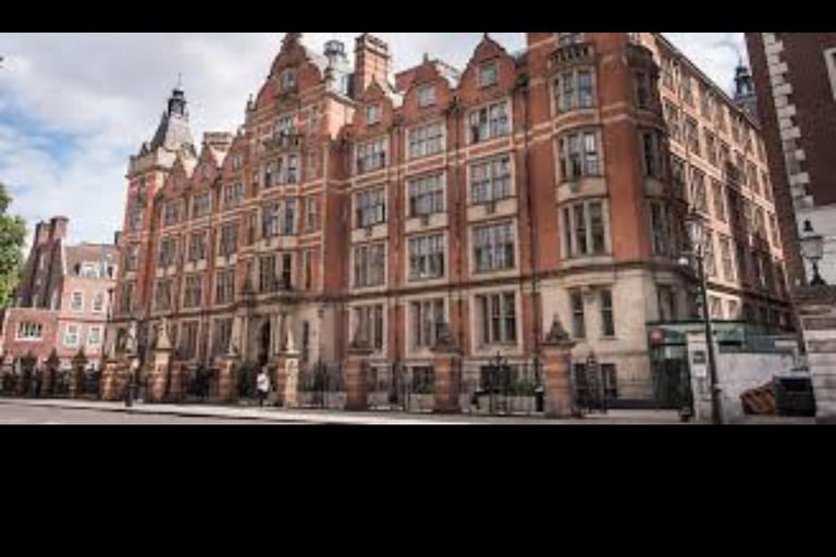 a large building with a clock tower in the middle of it