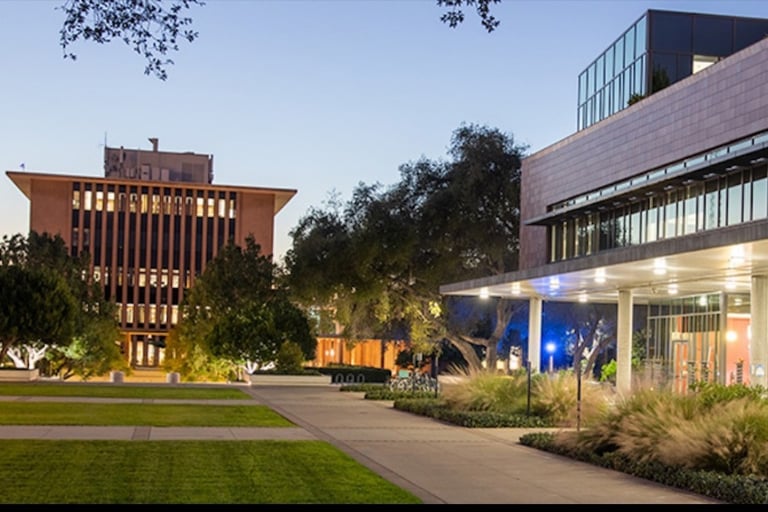 a building with a clock tower in the background