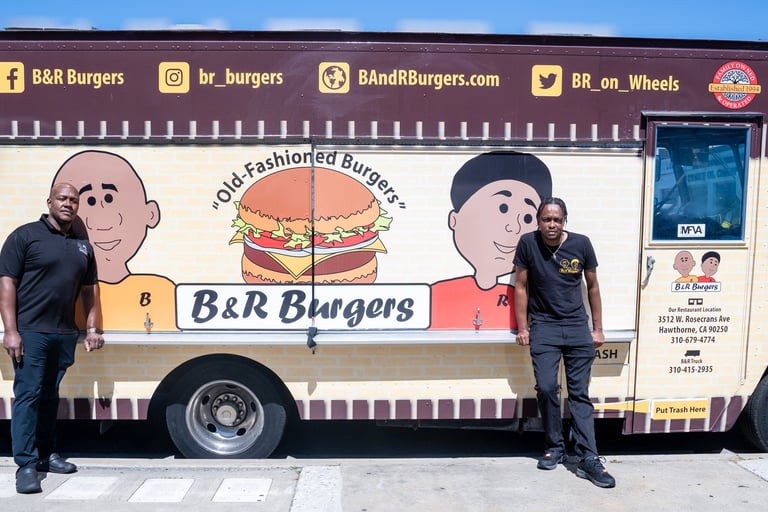 brother standing next to a food truck