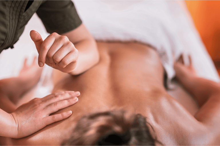 A woman getting a sports massage for her lower back.