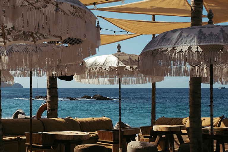 a beach with umbrellas and umbrellas on the beach