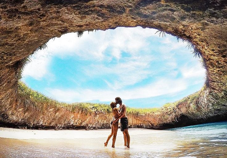 a couple kissing in a cave cave