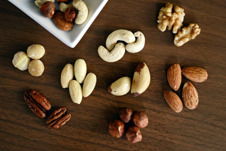 nuts like almond, walnuts  are on a table it is rich in vitamin b12