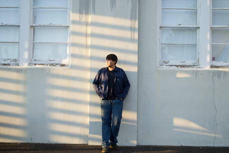 a man standing in front of a building