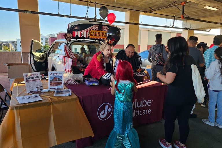 Jiffy Lube Employees passing out candy on Halloween