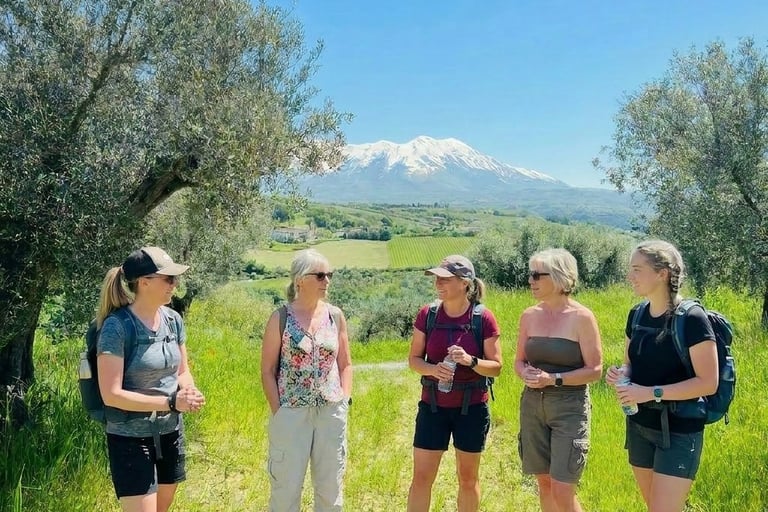 A group of women dressed for a hike in Abruzzo Borgo