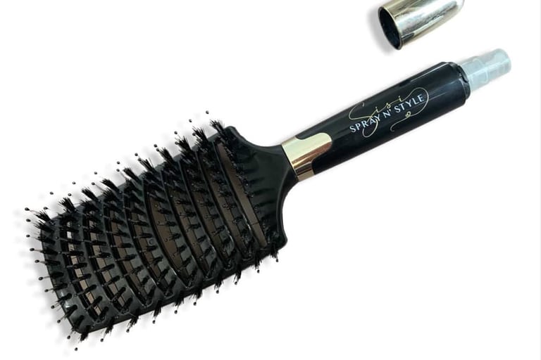 A picture of Sisi N’ Spray detangling brush designed for gentle, effective hair care.