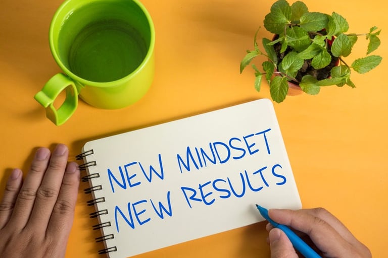 a person writing a new mindset new mindset new mindset new mindset