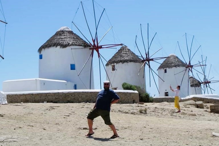 Danny posing in front of the iconic windmills on Mykonos.