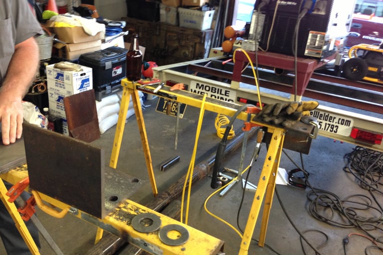 some random fabrication in an automotive shop, onsite for a customer