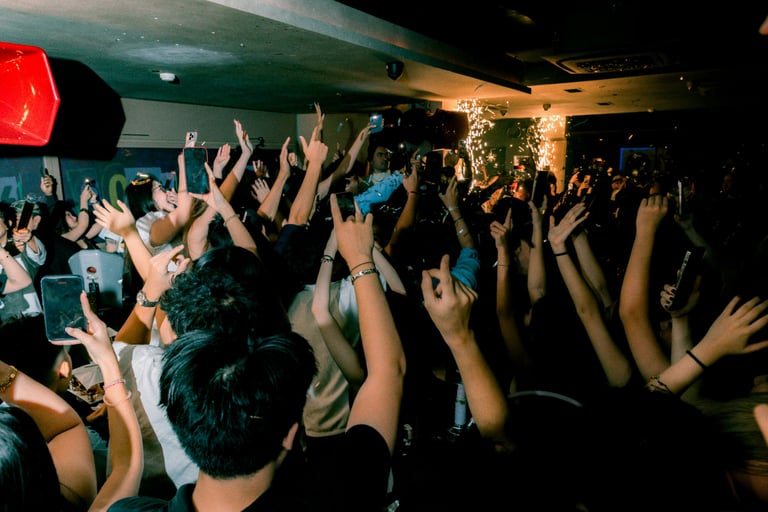 Neighborhood Saigon Nightclub with clients jumping and dancing