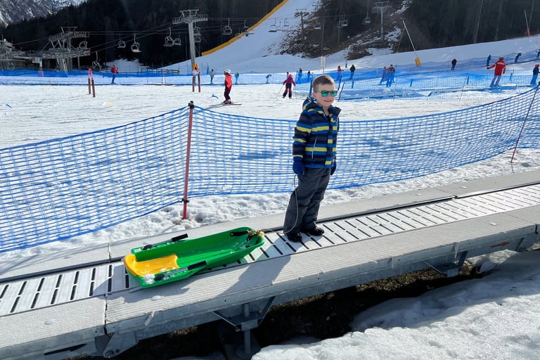 child sledging in la thuile