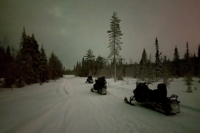 Snow mobiles out on a snow mobility ride in Ruka Finland 