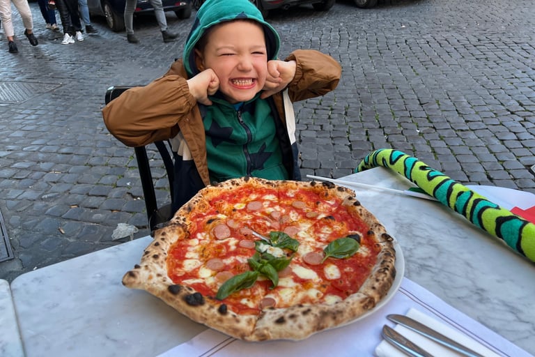 Child in Italy Rome eating pizza